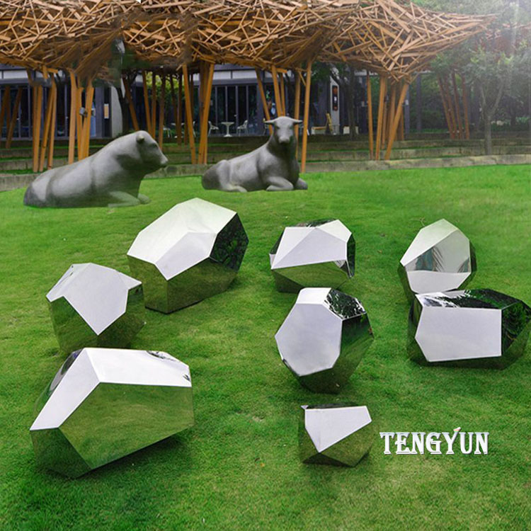 https://www.firststatue.com/park-garden-decorative-stainless-steel-abstract-rock-sculptures-polished-metal-stone-for-grass-land-decor-product/