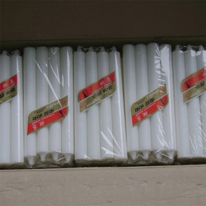 Violet candles in taper form, creating a serene ambiance. Violet candles in taper form, creating a serene ambiance.